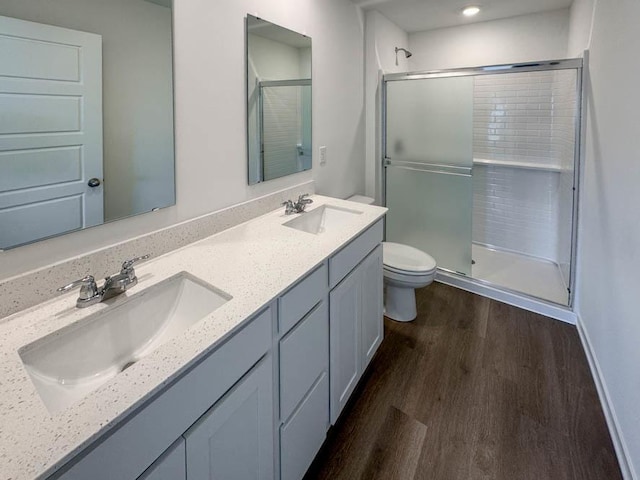 1120 58th Rd Unit 0012, Union Grove, WI 53182 - full bathroom featuring wood finished floors, a stall shower, and double vanity