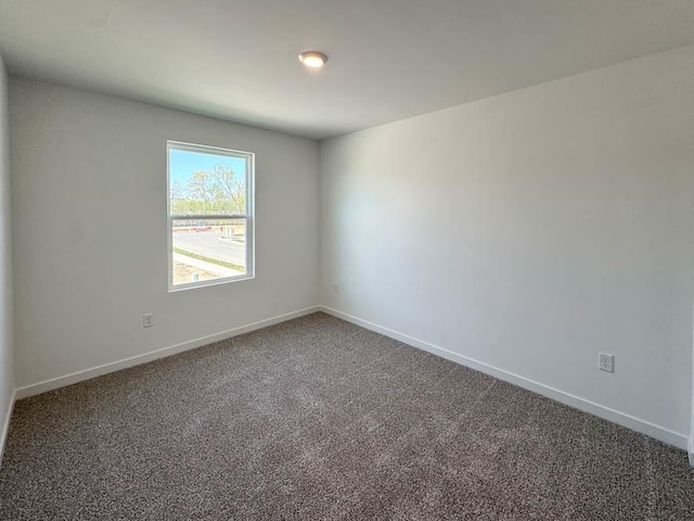 1120 58th Rd Unit 0012, Union Grove, WI 53182 - empty room with carpet flooring and baseboards