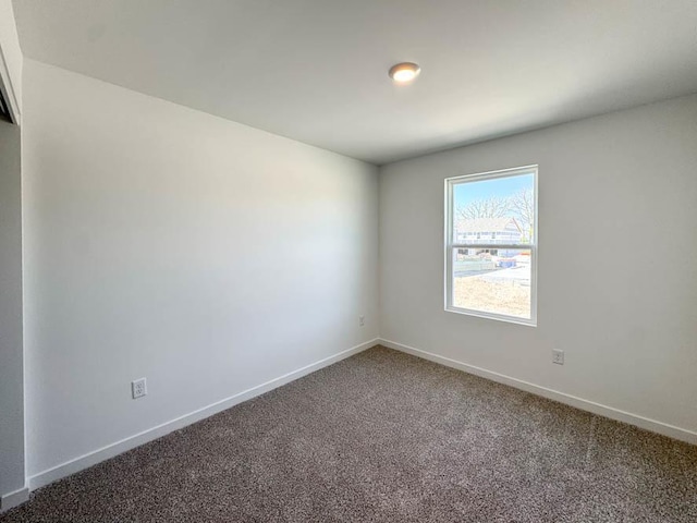 1120 58th Rd Unit 0012, Union Grove, WI 53182 - empty room with carpet flooring and baseboards