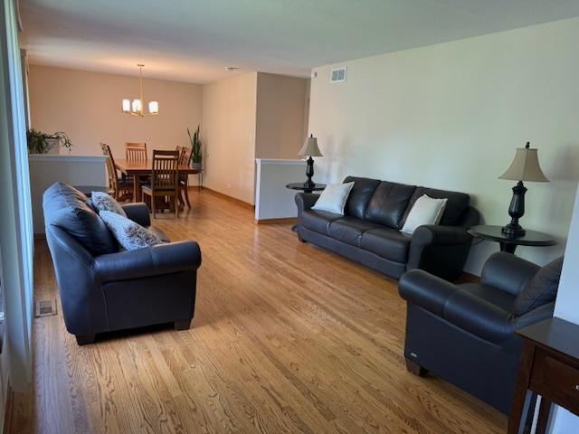 26587 N Cherrywood Ln, Wauconda, IL 60084 - living area with a chandelier and wood finished floors
