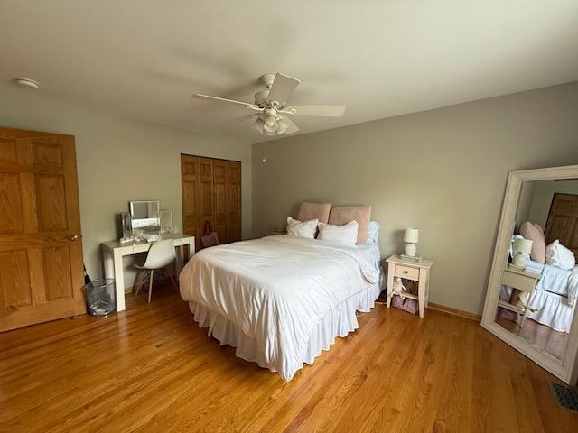 26587 N Cherrywood Ln, Wauconda, IL 60084 - bedroom featuring a closet, light wood finished floors, and ceiling fan