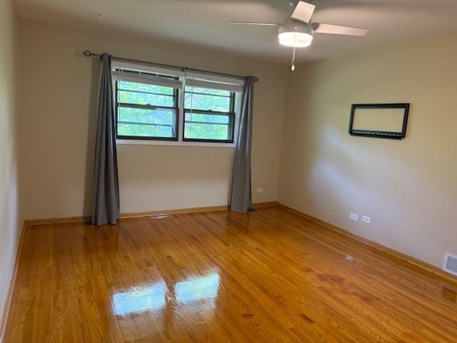 26587 N Cherrywood Ln, Wauconda, IL 60084 - empty room featuring light wood-style flooring and ceiling fan