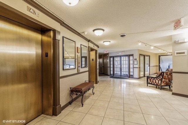 509 Aurora Ave Unit 305, Naperville, IL 60540 - building lobby featuring a textured ceiling