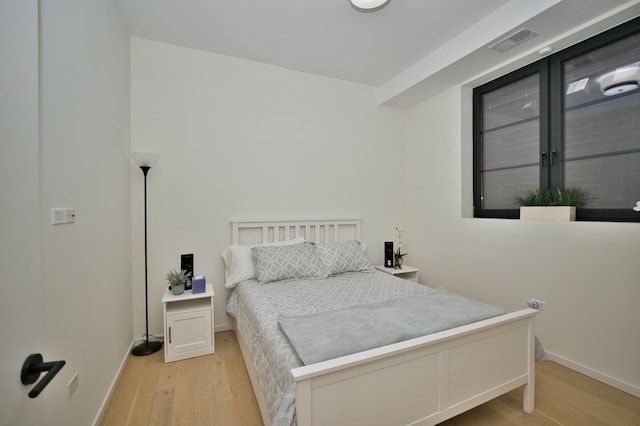 522 N Western Ave Unit 201, Chicago, IL 60612 - bedroom featuring light wood-style flooring and baseboards