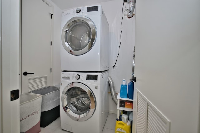 522 N Western Ave Unit 201, Chicago, IL 60612 - laundry room featuring estacked washer and dryer and light tile patterned floors
