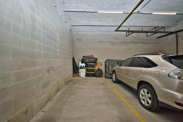 522 N Western Ave Unit 201, Chicago, IL 60612 - parking deck featuring concrete block wall