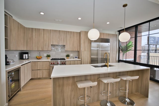 522 N Western Ave Unit 201, Chicago, IL 60612 - kitchen featuring modern cabinets, high quality appliances, wine cooler, and recessed lighting