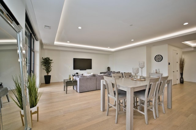 522 N Western Ave Unit 201, Chicago, IL 60612 - dining space with a raised ceiling, recessed lighting, and light wood finished floors