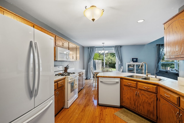 504 N Reef Rd, Lockport, IL 60441 - kitchen featuring white appliances, plenty of natural light, light wood-style flooring, a peninsula, and recessed lighting