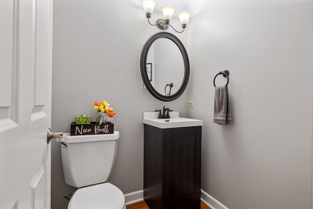 504 N Reef Rd, Lockport, IL 60441 - half bath with vanity, a chandelier, and wood finished floors