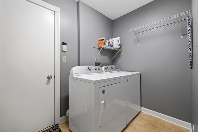 504 N Reef Rd, Lockport, IL 60441 - laundry room with washing machine and dryer and light tile patterned floors