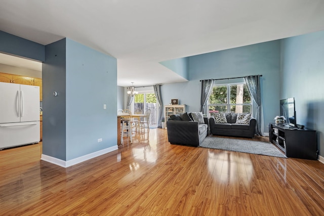 504 N Reef Rd, Lockport, IL 60441 - living area with a chandelier and light wood-style flooring