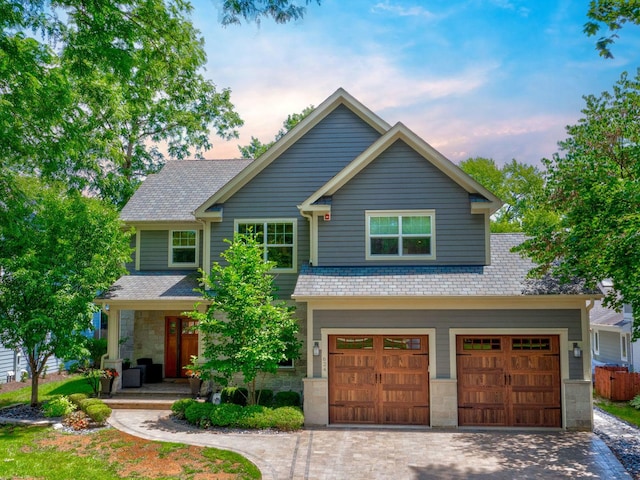 624 7th Ave, Libertyville, IL 60048 - craftsman inspired home with a porch, driveway, stone siding, and an attached garage