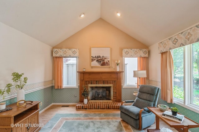 1808 N Normandy Ct, Arlington Heights, IL 60004 - living room with plenty of natural light, vaulted ceiling, a fireplace, and wallpapered walls