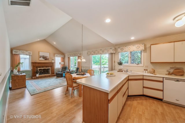 1808 N Normandy Ct, Arlington Heights, IL 60004 - kitchen featuring dishwasher, a peninsula, healthy amount of natural light, light countertops, and high vaulted ceiling