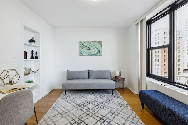 3150 N Lake Shore Dr Unit 8E, Chicago, IL 60657 - sitting room featuring wood finished floors and built in shelves