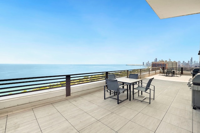 3150 N Lake Shore Dr Unit 8E, Chicago, IL 60657 - view of patio with outdoor dining space, a water view, and a view of skyline