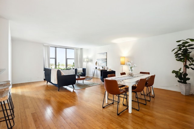 3150 N Lake Shore Dr Unit 8E, Chicago, IL 60657 - dining space featuring light wood finished floors and baseboards