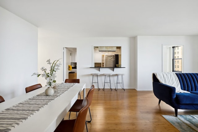 3150 N Lake Shore Dr Unit 8E, Chicago, IL 60657 - dining space with wood-type flooring and baseboards