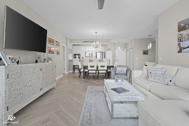 233 E 13th St Unit 2402, Chicago, IL 60605 - living room with a ceiling fan and a chandelier