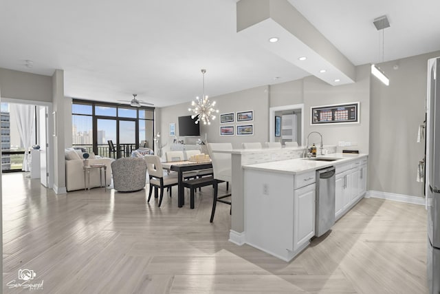233 E 13th St Unit 2402, Chicago, IL 60605 - kitchen with stainless steel dishwasher, open floor plan, decorative light fixtures, recessed lighting, and white cabinets
