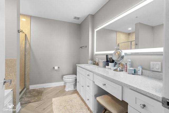 233 E 13th St Unit 2402, Chicago, IL 60605 - bathroom featuring a shower stall, vanity, and wood finished floors