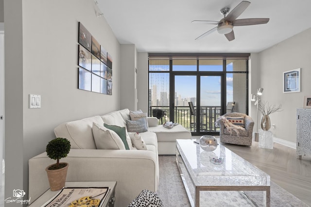 233 E 13th St Unit 2402, Chicago, IL 60605 - living area with a ceiling fan and baseboards