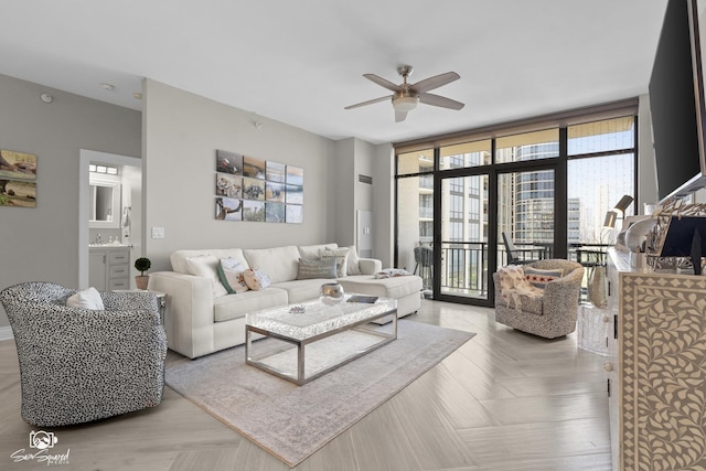 233 E 13th St Unit 2402, Chicago, IL 60605 - living room with ceiling fan and a wall of windows
