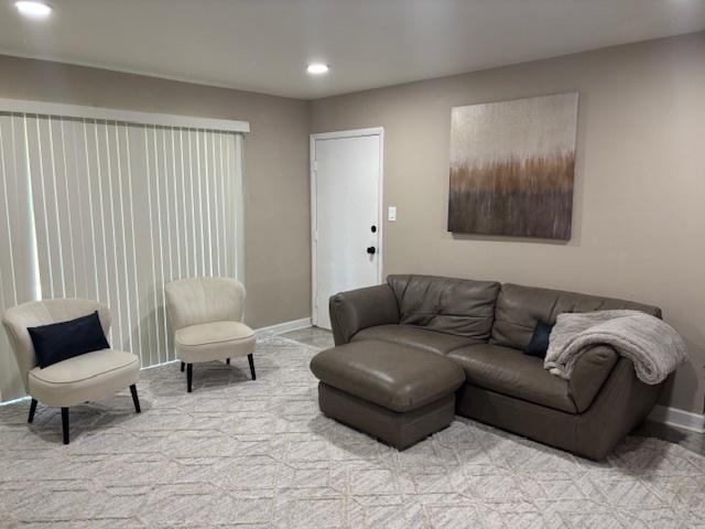 9388 Bay Colony Dr Unit 1S, Des Plaines, IL 60016 - living room with light colored carpet and recessed lighting