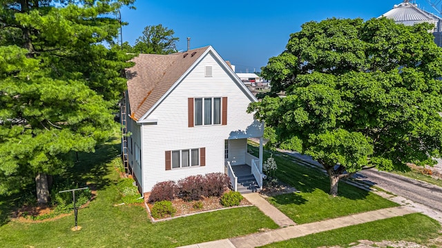 102 S Oak St, Arrowsmith, IL 61722 - view of front of house with a front lawn and a shingled roof