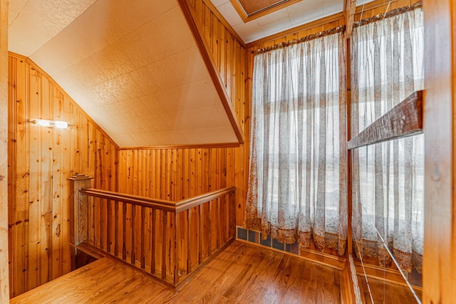 102 S Oak St, Arrowsmith, IL 61722 - stairs with wood finished floors, lofted ceiling, and wooden walls