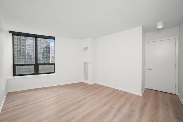 400 N Lasalle Dr Unit 2007, Chicago, IL 60654 - spare room with light wood finished floors and baseboards