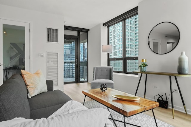 400 N Lasalle Dr Unit 2007, Chicago, IL 60654 - living room with expansive windows, wood finished floors, and a heating unit