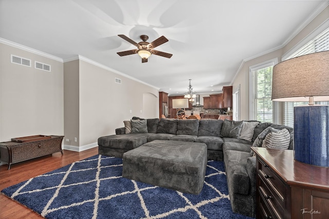 4037 Main St, Downers Grove, IL 60515 - living area featuring wood finished floors, ceiling fan, a chandelier, ornamental molding, and arched walkways