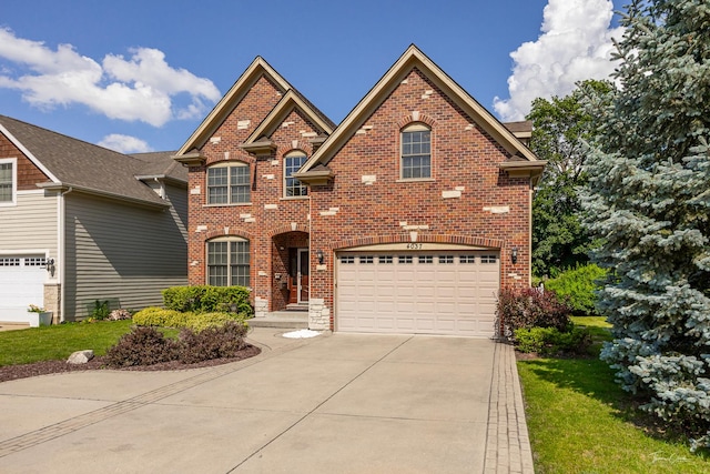 4037 Main St, Downers Grove, IL 60515 - traditional-style house with driveway, brick siding, and an attached garage