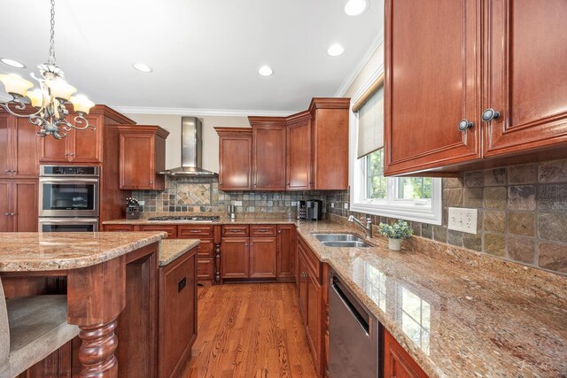 4037 Main St, Downers Grove, IL 60515 - kitchen with wall chimney exhaust hood, appliances with stainless steel finishes, crown molding, wood finished floors, and a chandelier