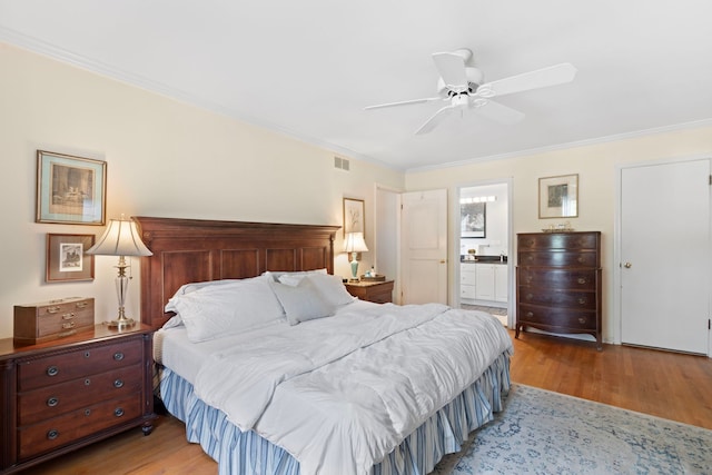 1014 Indian Rd, Glenview, IL 60025 - bedroom with crown molding, wood finished floors, connected bathroom, and ceiling fan