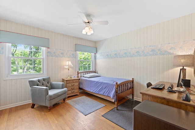 1014 Indian Rd, Glenview, IL 60025 - bedroom with wallpapered walls, wood finished floors, an office area, ceiling fan, and a wainscoted wall