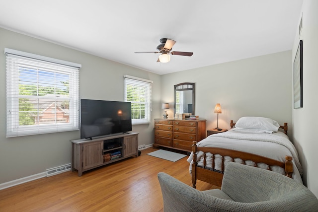 1014 Indian Rd, Glenview, IL 60025 - bedroom featuring multiple windows, light wood-type flooring, and ceiling fan