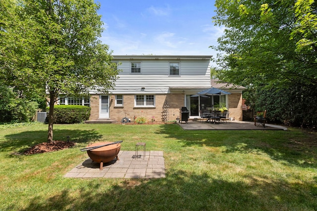 1014 Indian Rd, Glenview, IL 60025 - back of house with a patio, a yard, and brick siding