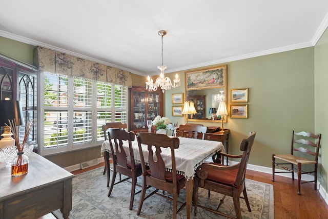 1014 Indian Rd, Glenview, IL 60025 - dining room featuring a chandelier, ornamental molding, and wood finished floors