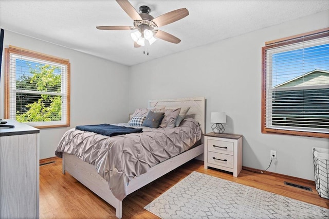 16 Rutherford Ct, Bloomington, IL 61705 - bedroom featuring light wood-style flooring and a ceiling fan
