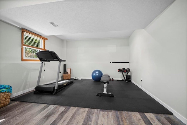 16 Rutherford Ct, Bloomington, IL 61705 - workout room with a textured ceiling and wood finished floors