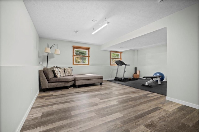 16 Rutherford Ct, Bloomington, IL 61705 - living room featuring wood finished floors and a textured ceiling