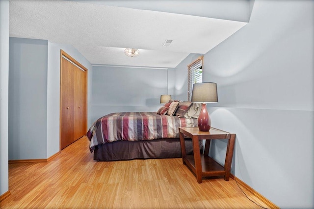 16 Rutherford Ct, Bloomington, IL 61705 - bedroom featuring wood finished floors and a closet