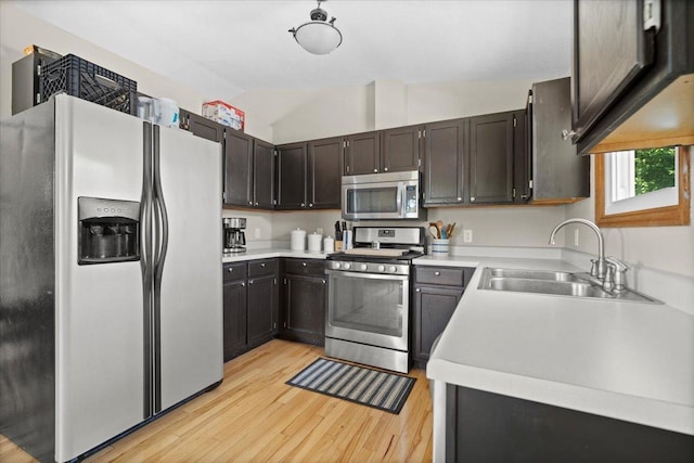 16 Rutherford Ct, Bloomington, IL 61705 - kitchen with appliances with stainless steel finishes, light wood finished floors, light countertops, and vaulted ceiling