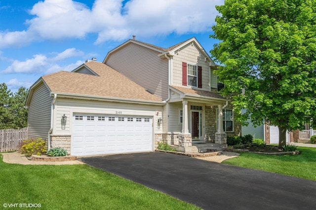2140 Colchester Ct, Hoffman Estates, IL 60192 - view of front facade featuring stone siding, asphalt driveway, an attached garage, and a shingled roof