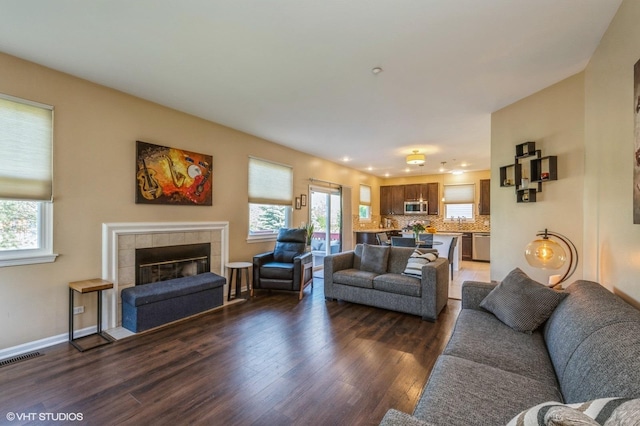 2140 Colchester Ct, Hoffman Estates, IL 60192 - living area with dark wood-type flooring, a fireplace, and recessed lighting
