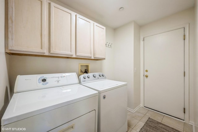 2140 Colchester Ct, Hoffman Estates, IL 60192 - washroom with separate washer and dryer, cabinet space, and light tile patterned floors
