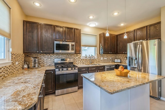 2140 Colchester Ct, Hoffman Estates, IL 60192 - kitchen with appliances with stainless steel finishes, dark brown cabinets, light stone countertops, light tile patterned floors, and recessed lighting